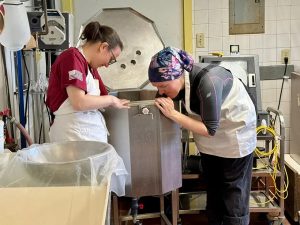 Interns working with cheese